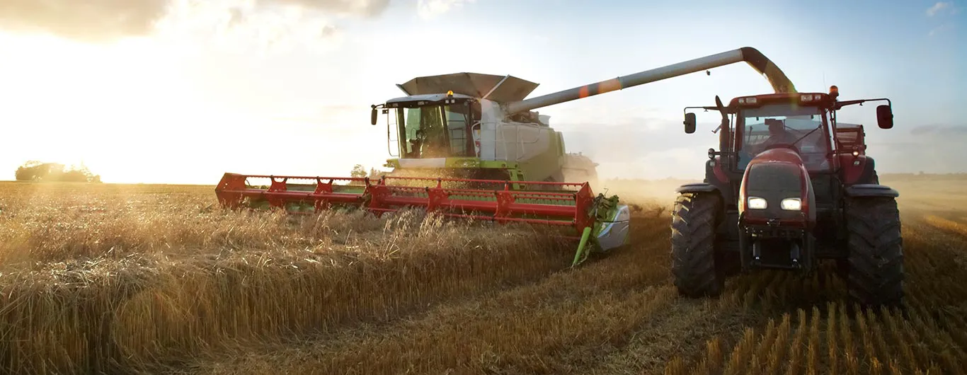 Tractor and Combine in a Field